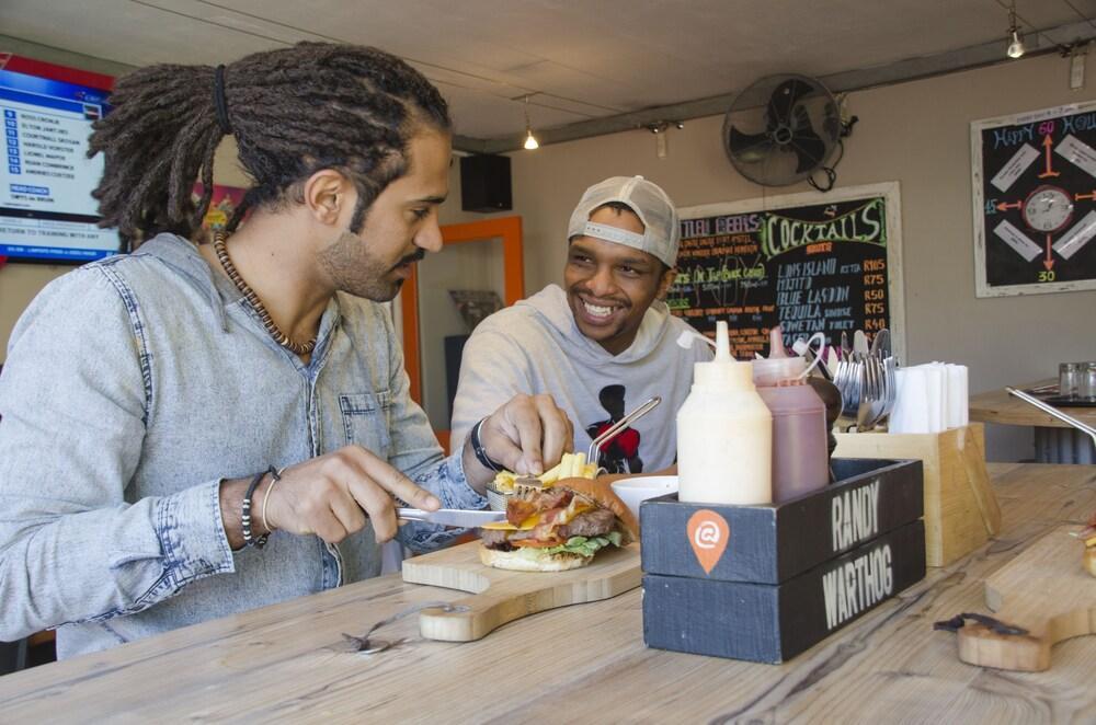 Never At Home Green Point Cape Town Bagian luar foto Customers at the counter at the restaurant