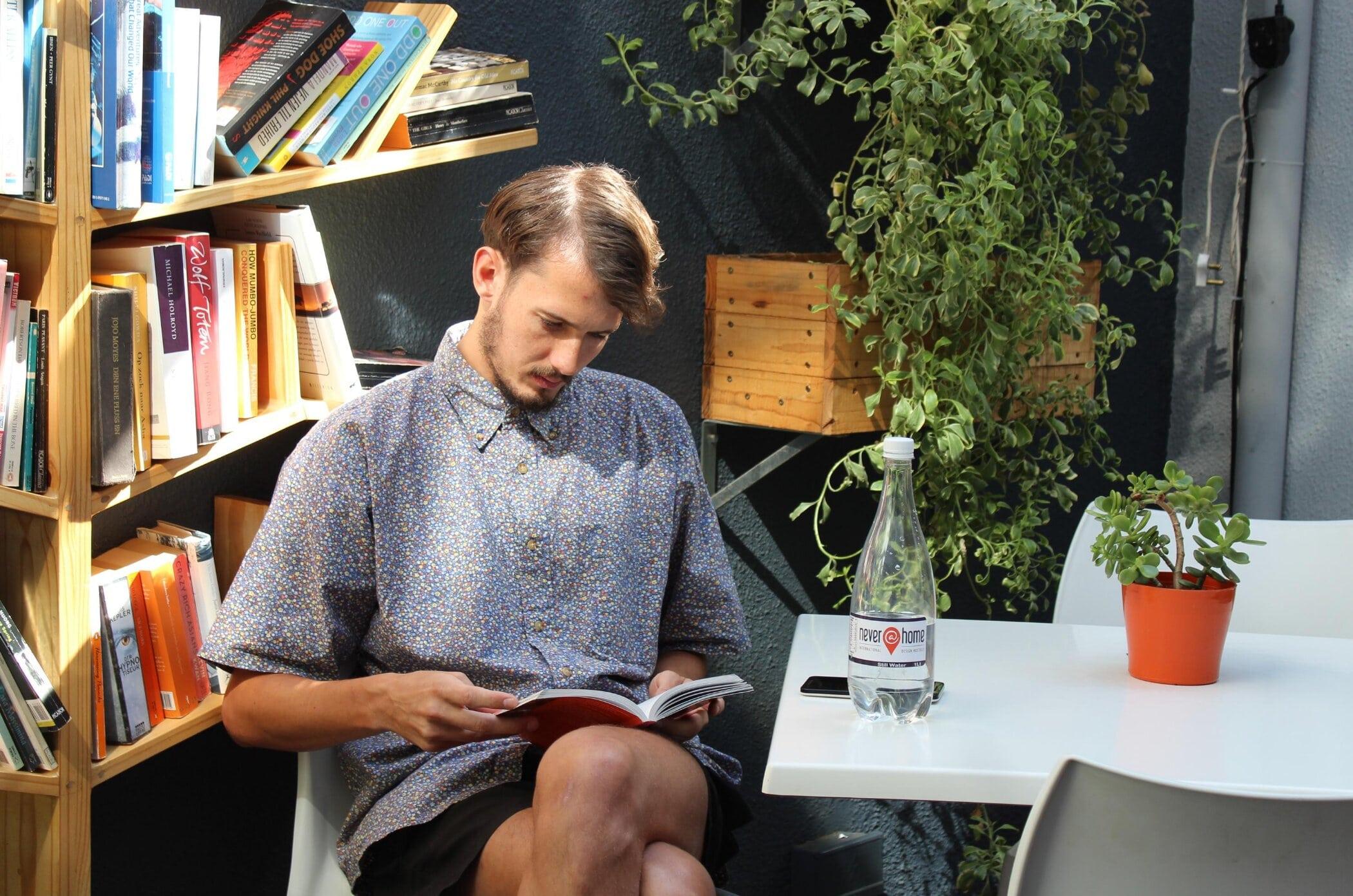 Never At Home Green Point Cape Town Bagian luar foto A man reading a book