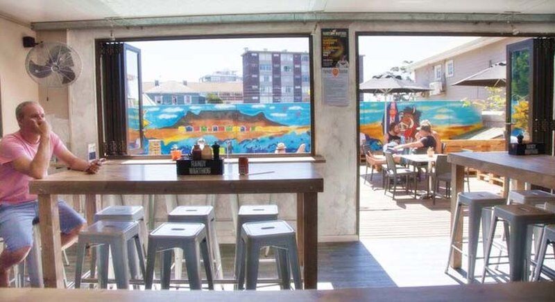 Never At Home Green Point Cape Town Bagian luar foto The interior of the restaurant